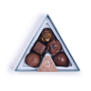 Rocky Mountain Chocolate's signature peak box features five delectable handmade milk chocolate treats: Sea Salt Caramel, Hazelnut Meltdown, Seafoam Dome, Rocky Road Cluster, and Cashew Mini Mogul. Each piece is meticulously crafted with the finest ingredients, promising an unforgettable taste experience
