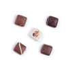 Image of Rocky Mountain Chocolate's assortment of handmade caramel chocolates, including Milk, White, and Dark varieties. Flavors consist of Kahlua & Cream, Dark Roasted Coffee, Sea Salt, Vanilla Bean, and Salted Truffle Caramel.