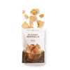 Bag of Classic Seafoam toffee with toffee pieces on a white background